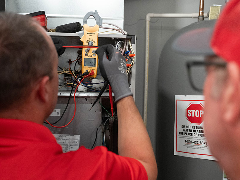 FURANCE-REPAIR-1 Age techs repairing a furnace
