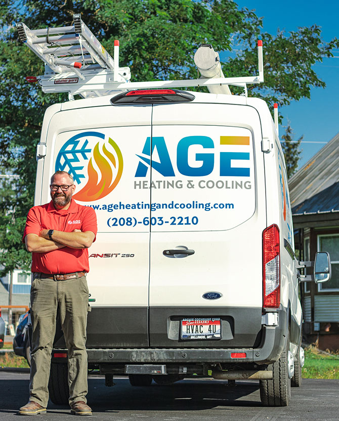 Owner standing by the work van