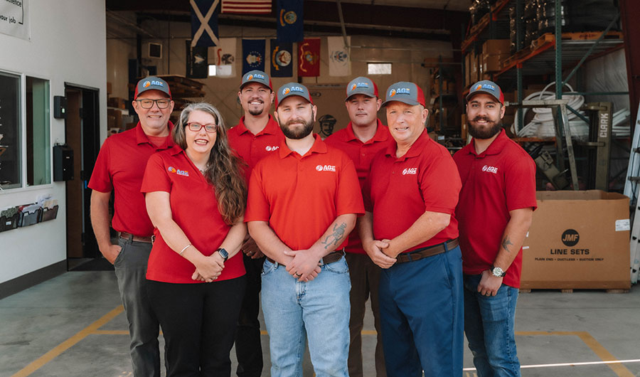 Group photo of the Age team in their shop